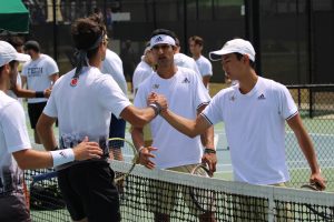 Keshav Chopra (left facing camera and Chen Dong), after clinching the doubles point for Ga Tech over Miami